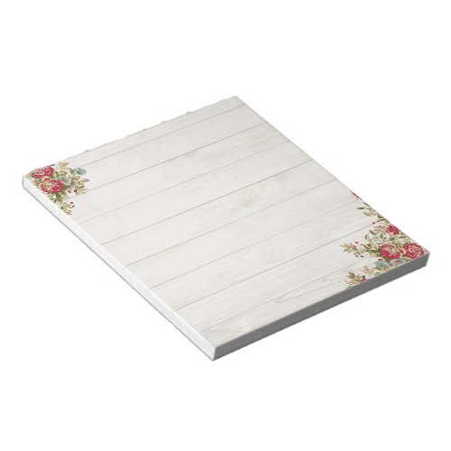 Red roses on wood notepad