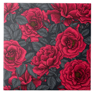 Red roses with gray leaves on black ceramic tile