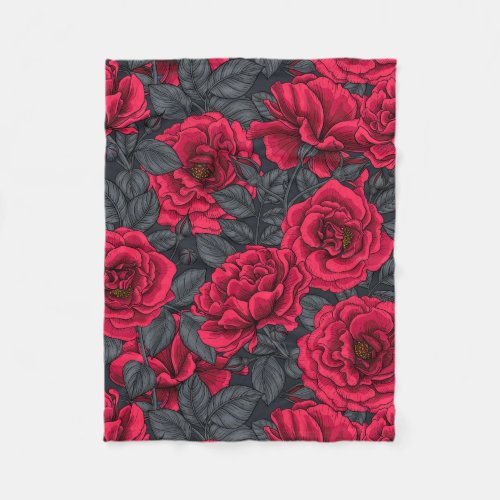 Red roses with gray leaves on black fleece blanket