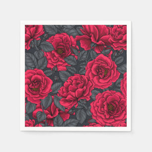 Red roses with gray leaves on black napkins