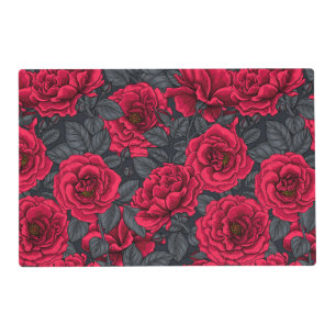 Red roses with gray leaves on black placemat
