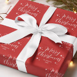 Red Script Typography Family Name Merry Christmas Wrapping Paper<br><div class="desc">Red script typography Merry Christmas wrapping paper with festive Holiday stars. Personalize this gift wrap with the family name,  year,  or any custom text.</div>