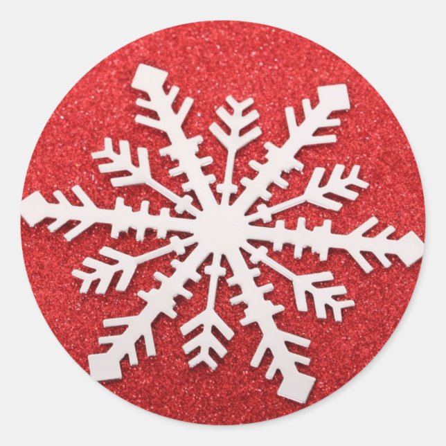 Red snowflake on a red glitter background classic round sticker (Front)