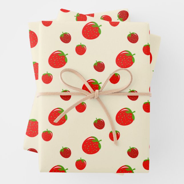 Red strawberry pattern on pale pink wrapping paper sheets (In situ)