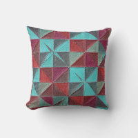 red, teal, purple, and gray quilt