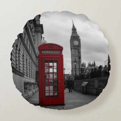 Red telephone box in London round pillow