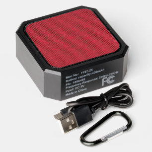 Red textured surface with subtle swirling pattern bluetooth speaker