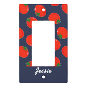 Red tomatoes on blue light switch cover
