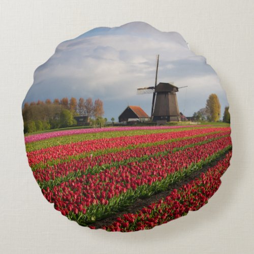 Red tulips and a windmill round pillow