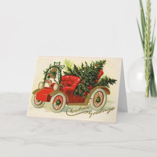 RED VINTAGE CAR WITH CHRISTMAS TREES AND BELL HOLIDAY CARD