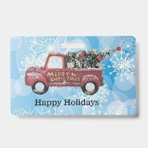 red vintage truck on a blue snowflake background badge