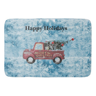 red vintage truck on a blue snowflake background bath mat