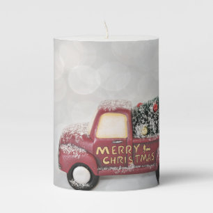 red vintage truck on a grey bokeh background pillar candle