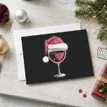 Red Wine Glass Santa Hat Christmas Holiday Card<br><div class="desc">Red Wine Glass Santa Hat Christmas Holiday features a festive red wine glass topped with a Santa hat on a dark background. The design has a cheerful holiday look with sparkling details that make it stand out. It is a fun seasonal choice for wine lovers, Christmas party themes, and anyone...</div>