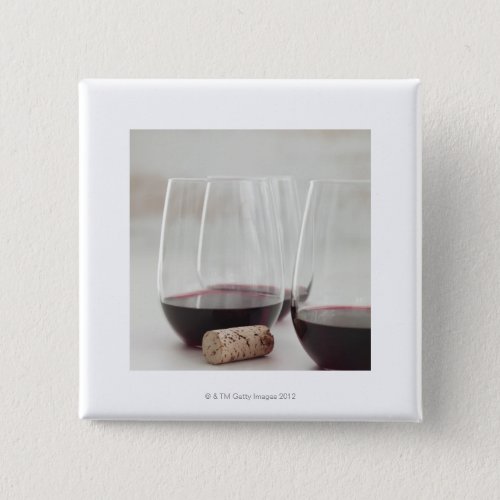 Red wine in stemless glasses button