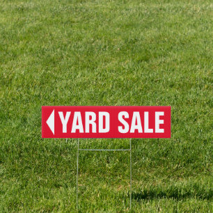 Red yard sale sign with directional arrow
