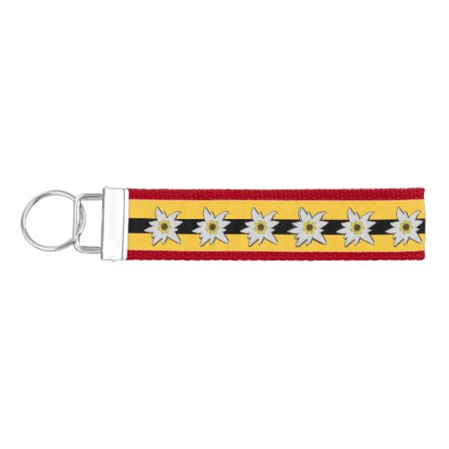 Red Yellow and Black with White Edelweiss Flowers Wrist Keychain