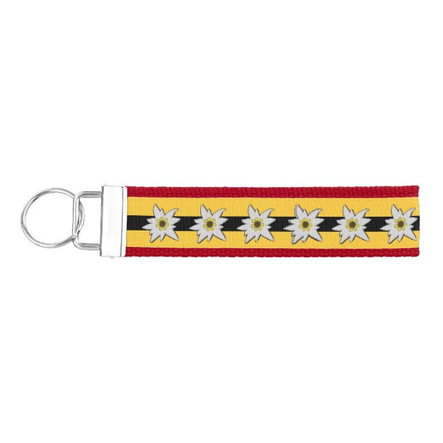 Red, Yellow and Black with White Edelweiss Flowers Wrist Keychain (Keys on Left)