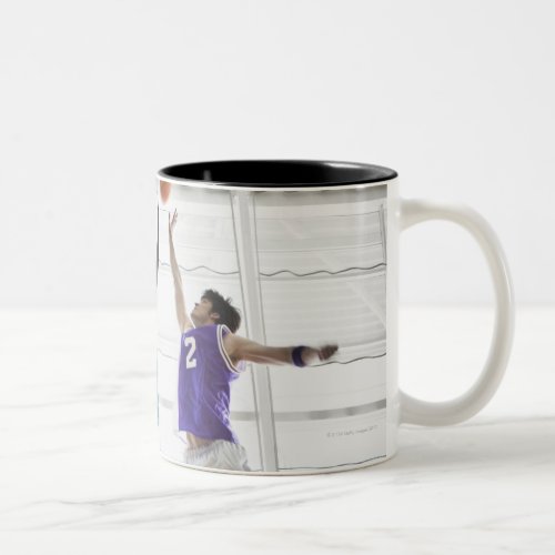 Referee watching basketball players jumping Two_Tone coffee mug