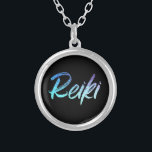 *~* Reiki Healer Jewelry With Intention (R)<br><div class="desc">*Round necklace with a black background with the word "Reiki" in a gradient iridescent neon design. The word "Reiki" is mostly turquoise with some gradient areas that are purple. * Reiki Masters, Reiki Practitioners and Reiki Students will not be the only ones drawn to this stunning necklace. This necklace would...</div>