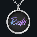 *~* Reiki Jewelry With Intention (R) High Vibe<br><div class="desc">*Round necklace with a black background with the word "Reiki" in a gradient iridescent neon design.* Reiki Masters, Reiki Practitioners and Reiki Students will not be the only ones drawn to this stunning necklace. This necklace would make a great gift to someone newly attuned to Reiki. If you find yourself...</div>