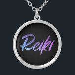 *~* Reiki Jewelry With Intention (R) High Vibe<br><div class="desc">*Round necklace with a black background with the word "Reiki" in a gradient iridescent neon design.* Reiki Masters, Reiki Practitioners and Reiki Students will not be the only ones drawn to this stunning necklace. This necklace would make a great gift to someone newly attuned to Reiki. If you find yourself...</div>