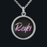 *~* Reiki Jewelry With Intention (R) Pink Text<br><div class="desc">*Round necklace with a black background with the word "Reiki" in an iridescent pink text design.* Reiki Masters, Reiki Practitioners and Reiki Students will not be the only ones drawn to this amazing necklace. This little beauty will make a great gift to someone newly attuned to Reiki. If you find...</div>