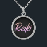 *~* Reiki Jewelry With Intention (R) Pink Text<br><div class="desc">*Round necklace with a black background with the word "Reiki" in an iridescent pink text design.* Reiki Masters, Reiki Practitioners and Reiki Students will not be the only ones drawn to this amazing necklace. This little beauty will make a great gift to someone newly attuned to Reiki. If you find...</div>