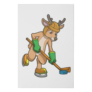 Reindeer at Ice hockey with Ice hockey stick Faux Canvas Print