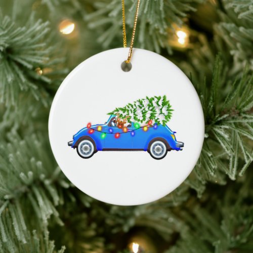 Reindeer driving a beetle with christmas treeb ceramic ornament