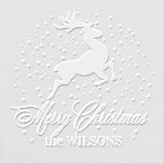 Reindeer In Snow Merry Christmas ID953 Embosser<br><div class="desc">Tiny snowflakes create a polka dot pattern behind a prancing reindeer on this pretty Christmas embosser design. Flowing script text of 'Merry Christmas' typography accompanies your name or names to finish this charming addition to your Christmas mailing accessories.</div>