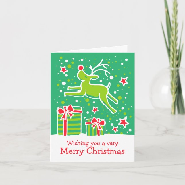 Reindeer prancing over gifts green Christmas card (Front)