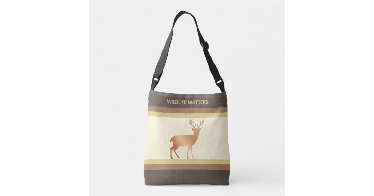 Reindeer silhouette on ivory & brown shades crossbody bag | Zazzle
