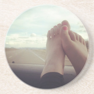 relax feet on the dashboard drink coaster
