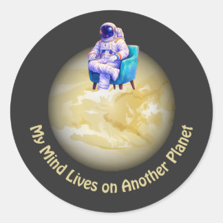 Relaxed Astronaut Sitting on Planet  Classic Round Sticker