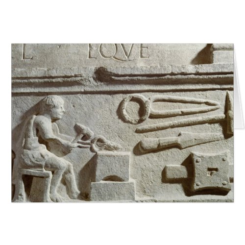 Relief depicting a blacksmiths shop and tools