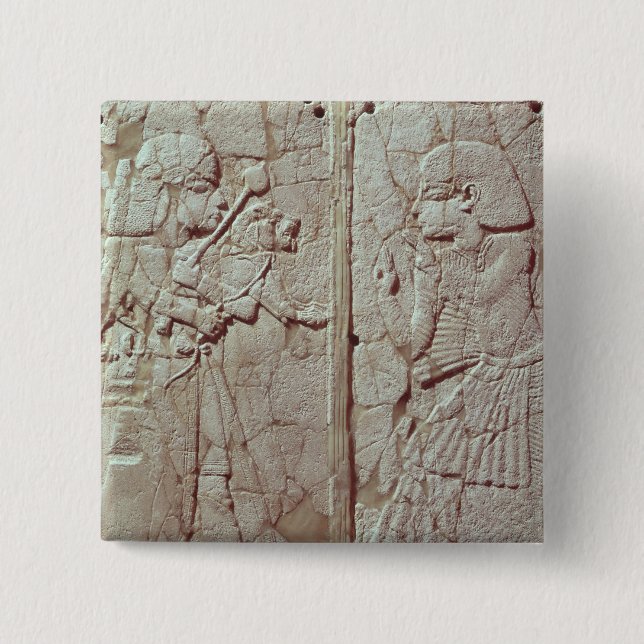 Relief depicting a guard holding button (Front)