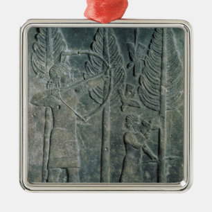 Relief depicting the hunting of birds in the metal ornament