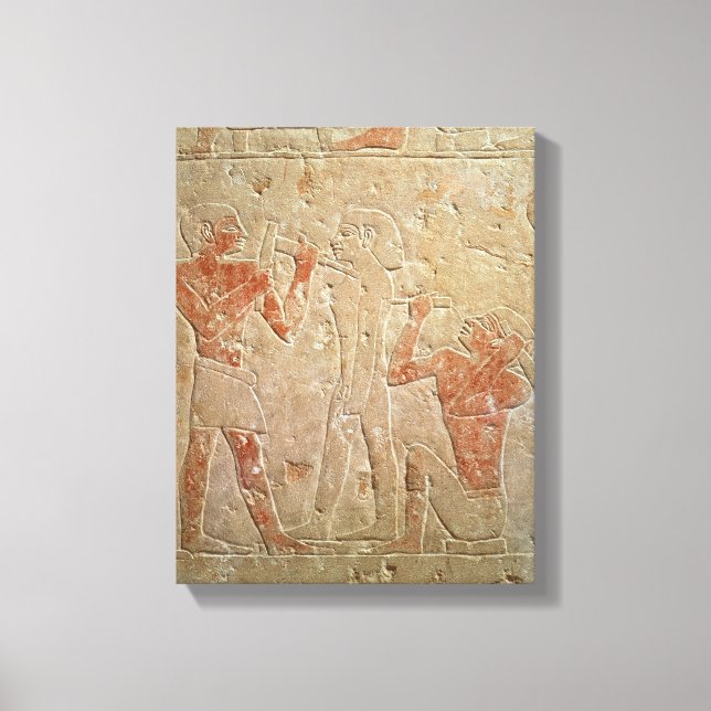 Relief depicting two sculptors carving a canvas print (Front)