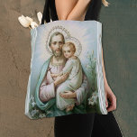 Religious St. Joseph with Child Jesus Tote Bag<br><div class="desc">Beautiful vintage traditional Catholic religious image of St. Joseph holding the Child Jesus. A cross is in His hands and lilies on each side.</div>