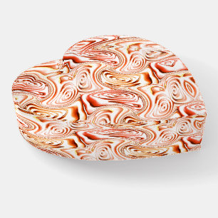 Repeating forming some reddish flower or butterfly paperweight