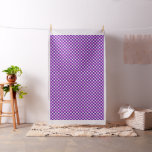 Repeating stars pattern on purple fabric