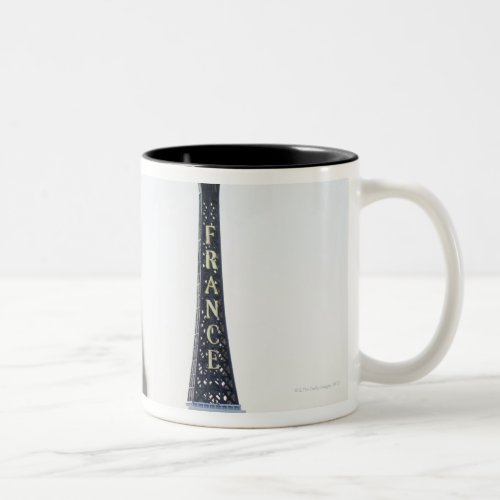 Replica of Eiffel Tower with original one in the Two_Tone Coffee Mug