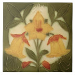 Repro Art Nouveau Tubelined Daffodil Trio Ceramic Tile<br><div class="desc">Reproduced from a circa 1900 art nouveau tube lined tile, which means that the original tile has raised outlines. This tile, however is flat and smooth and only looks dimensional. A very cheerful looking trio of yellow and orange daffodils against a cream circle set into the green background.</div>