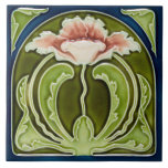 Reproduction Art Nouveau Pink Poppy on Green Tile<br><div class="desc">The Art Nouveau style began in the last decade of the 19th century and lasted until WWI. Art Nouveau is,  in many ways,  an outgrowth of the Arts & Crafts movement. Art Nouveau tiles feature stylized designs with flowing curves based on natural forms.</div>