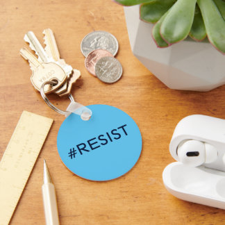 #Resist, black text on sky blue keychain