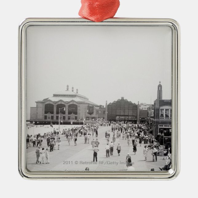 Resort tourists on esplanade metal ornament (Front)