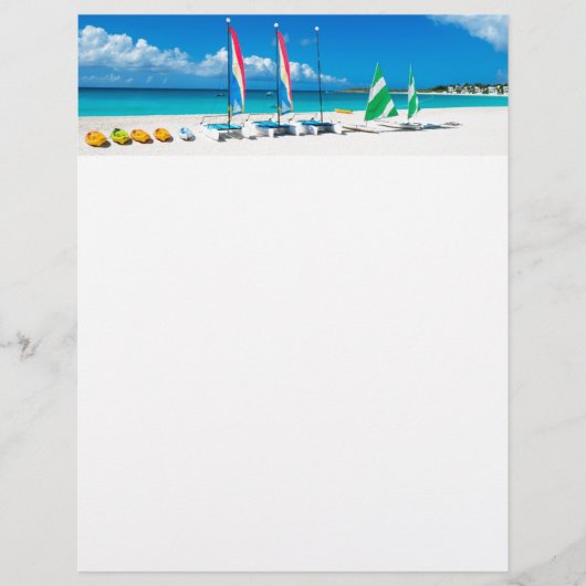 Resort's beach with boats on it (Front)