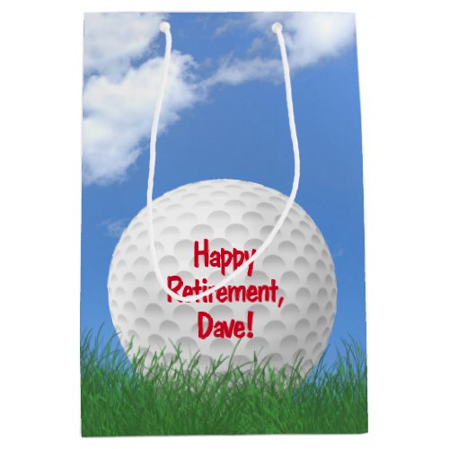 Retirement golf ball in grass with name medium gift bag