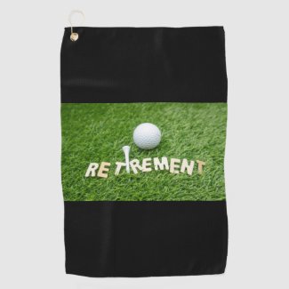 Retirement with golf ball on green Golf Towel